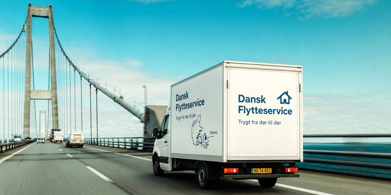 Moving van on bridge towards Sweden