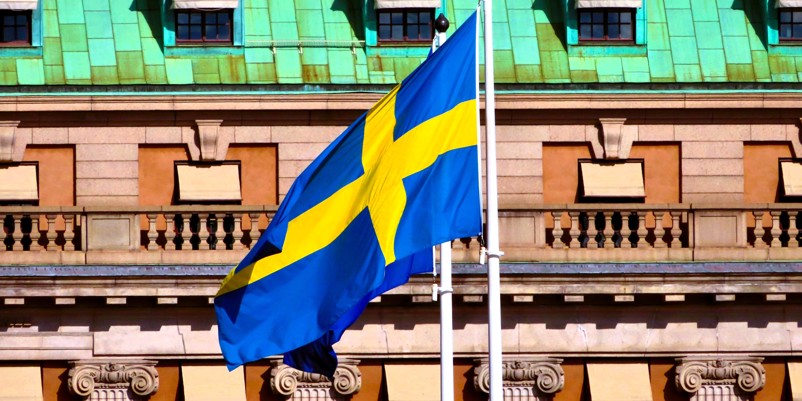 Swedish flag in front of a government building